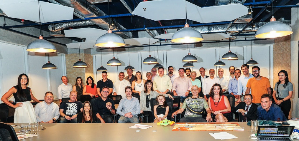 A diverse group gathered around the table during a collaborative workshop